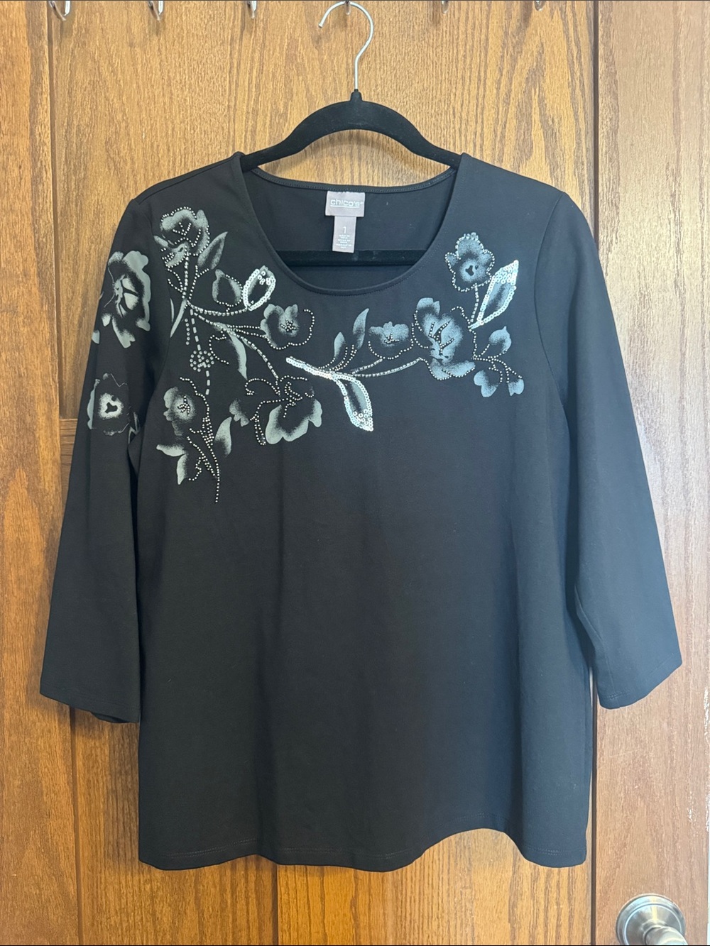 Chico’s Black Long Sleeve Scoop Neck Top with Silver Floral Accent